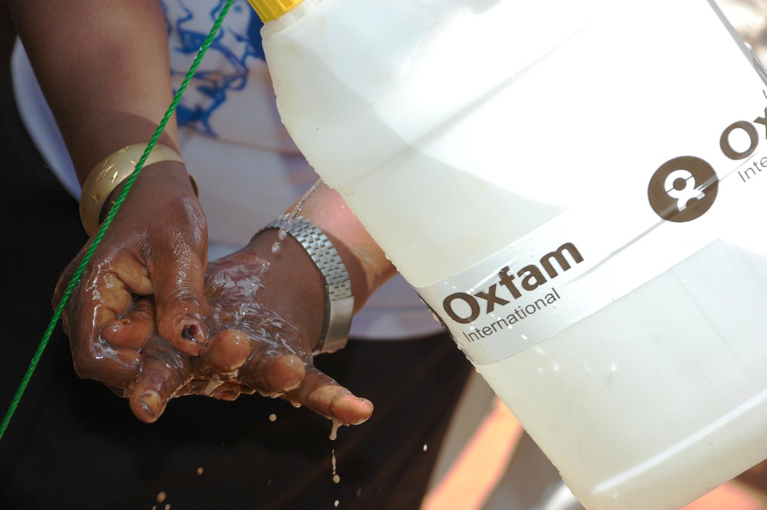 An Oxfam 'Tippy Tap' handingwashing station is being used in Wau's Cathedral settlement for displaced people.