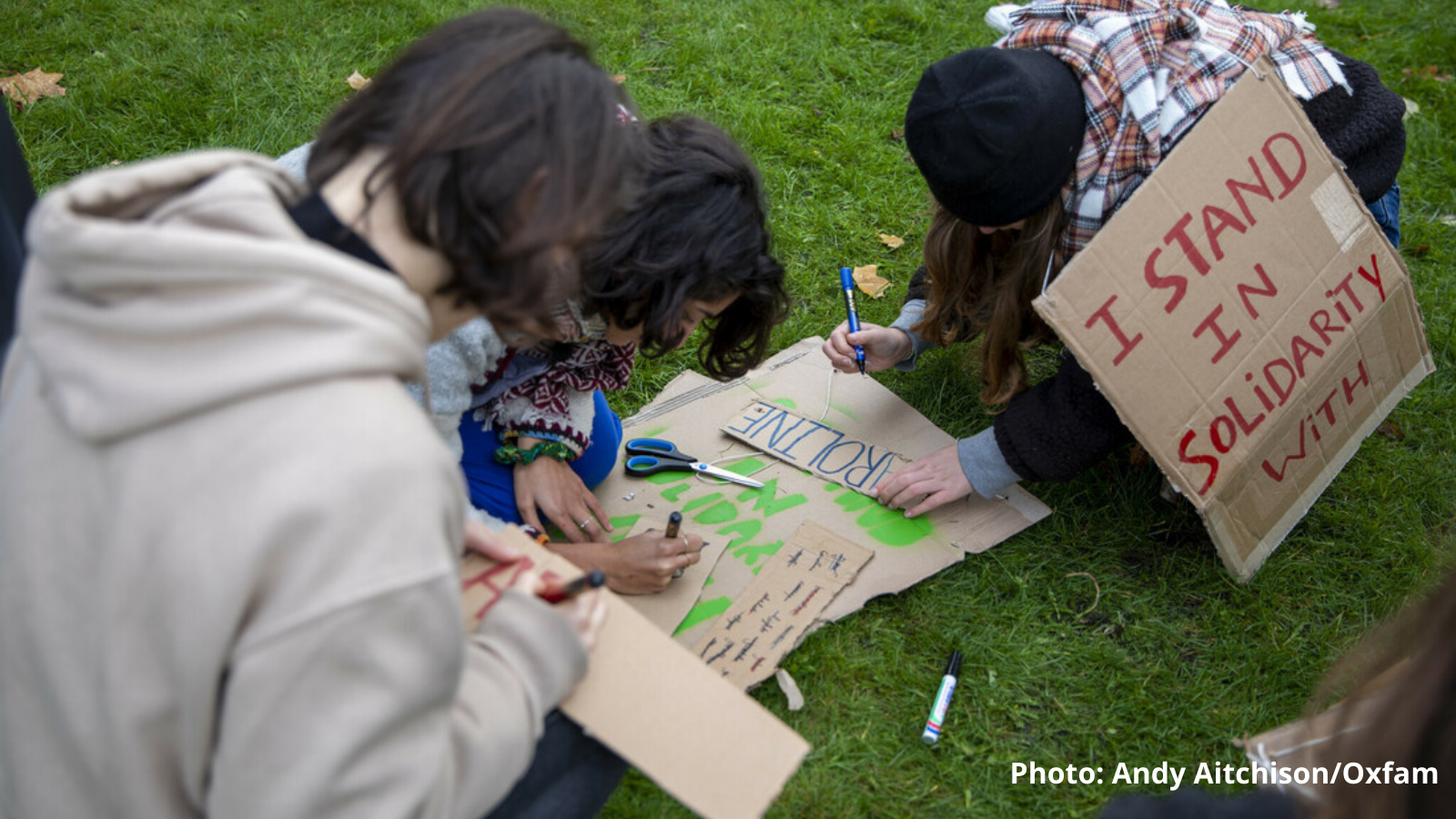 Young Belgian climate activists make placards for the Global Day of Action